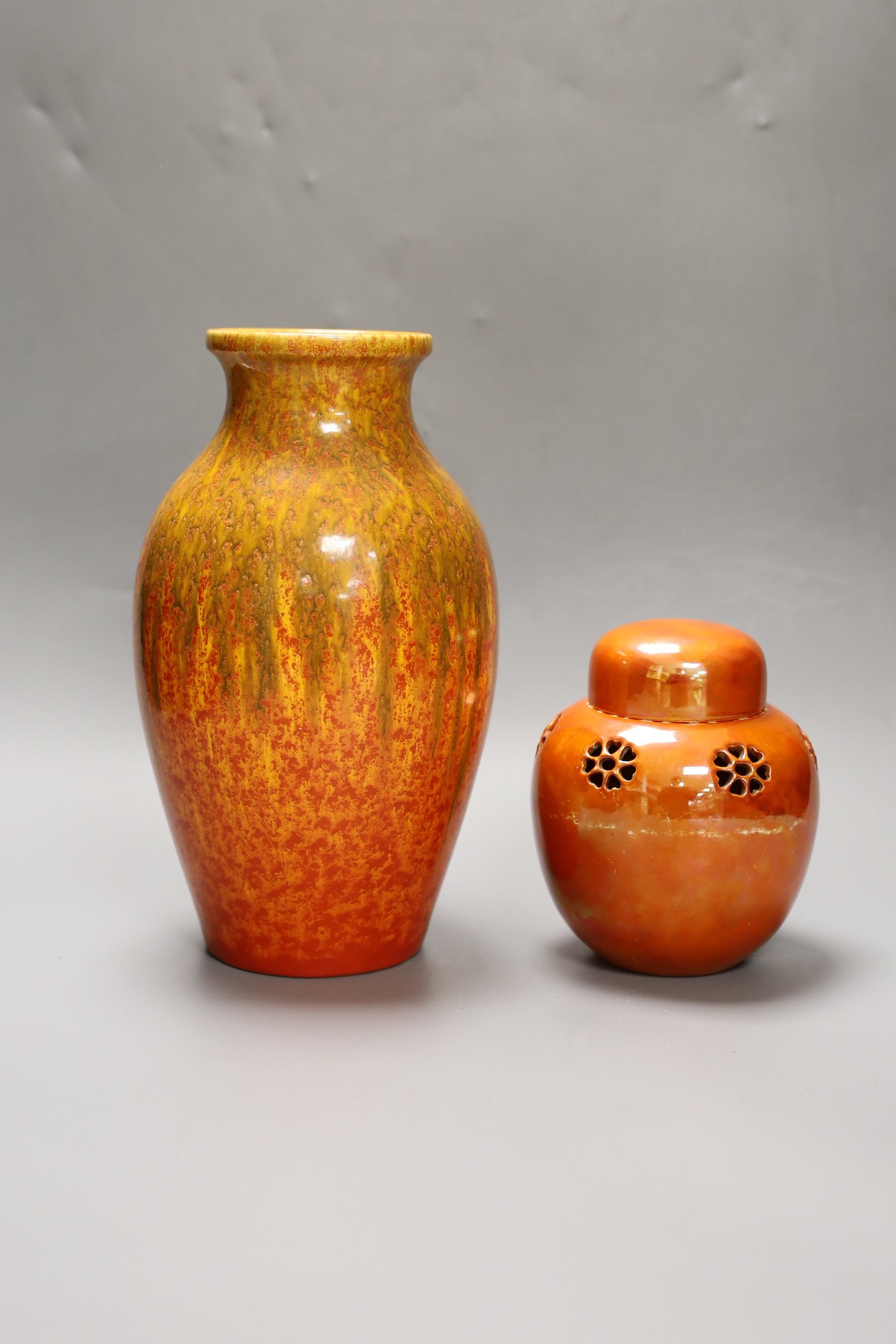 A Pilkington‘s Royal Lancastrian mottled orange ground vase and a Ruskin Orange lustre jar and cover, dated 1914, tallest 25cm